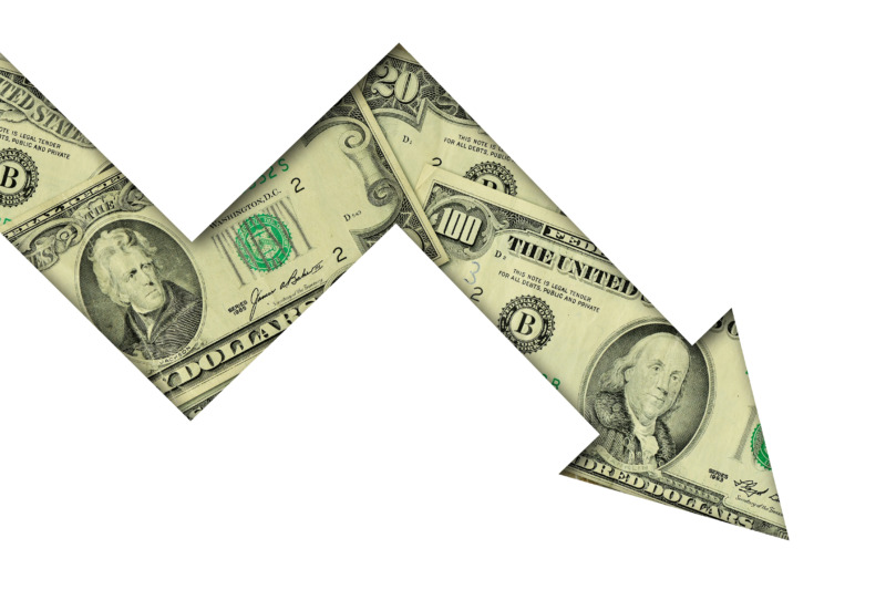 Downward arrow made of dollar coins and banknotes on white background - Concept of loss of money and downward trend of dollar currency