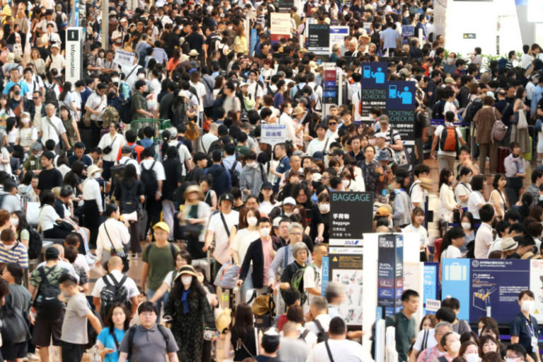 Haneda airport is crowded with summer vacationers